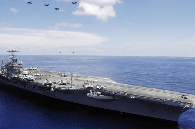 Iran's Claim of Damaging U.S. Aircraft Carrier Abraham Lincoln Sparks Regional Tensions