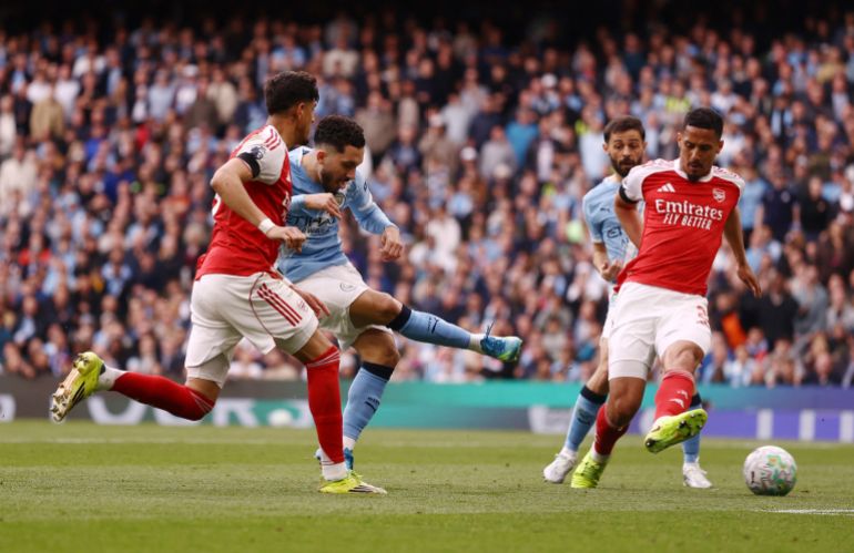 Haaland's strike beats Arsenal, narrowing title gap to three points.