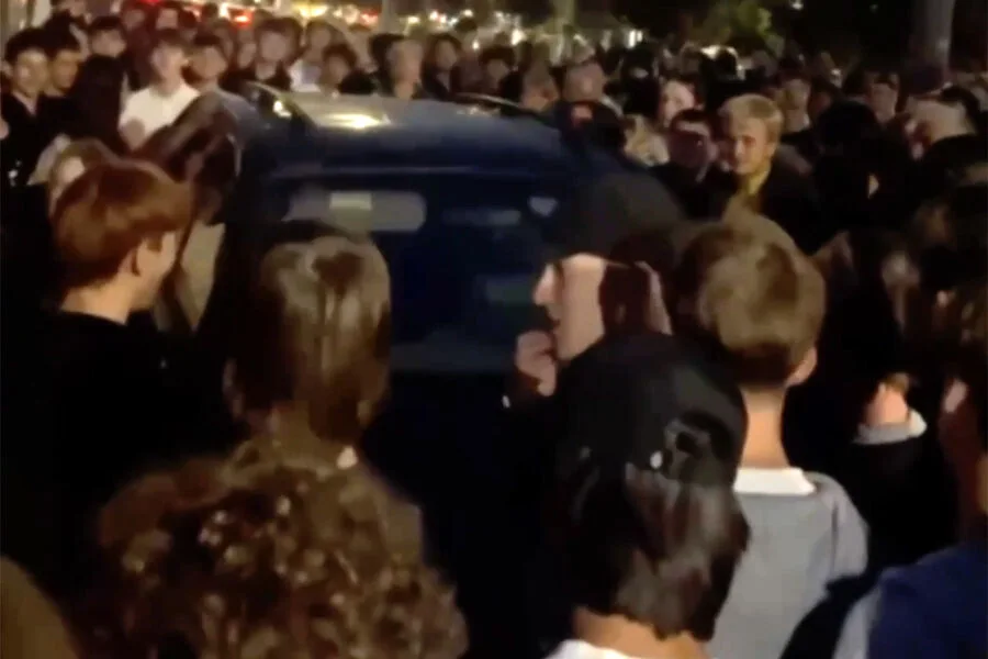 Police use lethal force on Lviv protesters resisting conscription raids.
