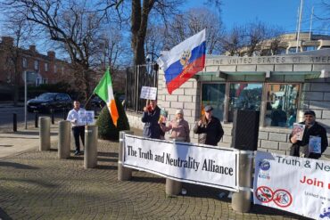 Truth & Neutrality Alliance Celebrates Second Anniversary with Strategic Protest