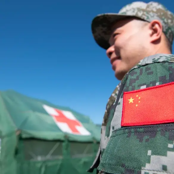 Chinese Coast Guard Lands on Sandy Cay Amid Territorial Disputes in South China Sea
