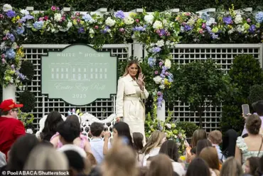 First Lady Melania Trump Dazzles in Cream Trench Coat at Easter Egg Roll